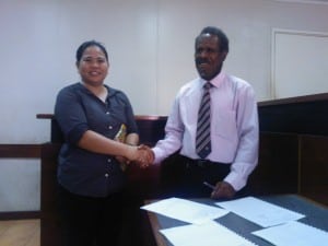 Femili PNG's CEO and His Worship Singomat on signing the MoU with Lae Court.